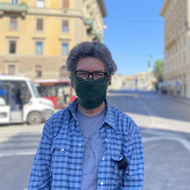 Portrait of Jeremy Cherfas wearing a homemade mask at the bus terminus in Roma centro