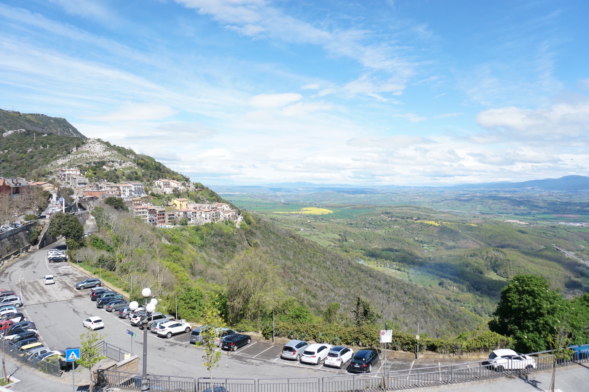 A view down onto the carpark with the landscape stretching away below