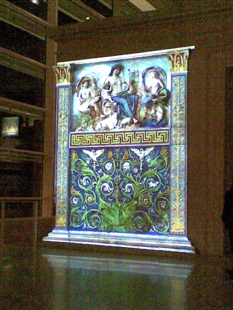 The Ara Pacis monument illuminated by coloured projection.