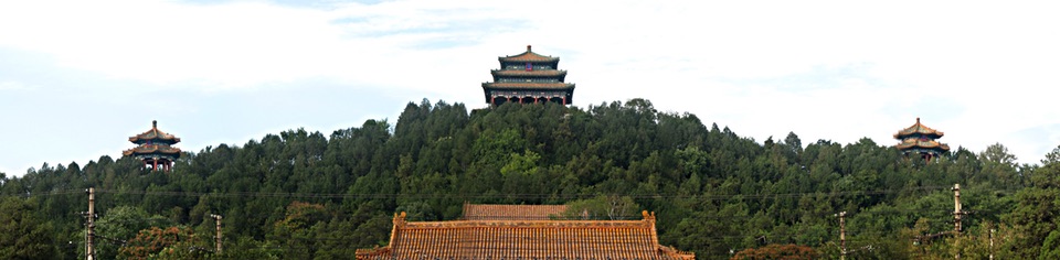 Panorama of Jingshang Park opposite the back entrance to the Forbideen City, with three pagodas symmetrically placed on the skyline