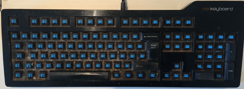 dirty keyboard with all keycaps removed