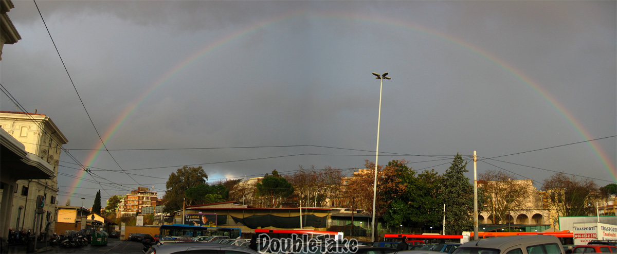 Panoramic picture of a rainbow over Trastevere Station stitched by doubletake software.