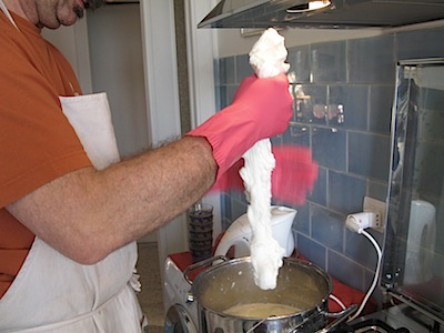 Working the hot, melted proto-mozzarella