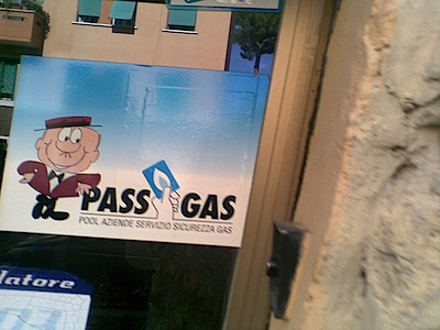Sticker on a door advertising a household gas subscription service called Pass Gas