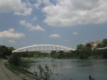 Arched white footbridge over the Tiber